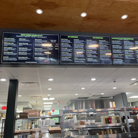 digital menu spread across 5 TV monitors